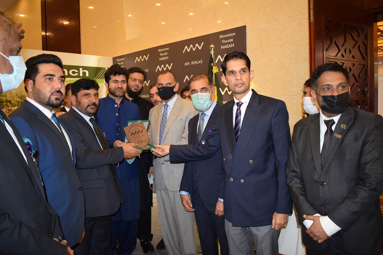 Honoring former Federal Minister during a meeting with advisory and audit client, Mountain Village Naran (MVN)